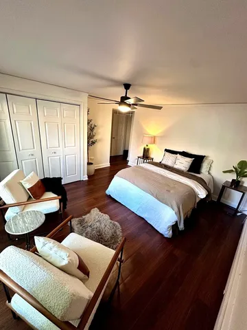 a bedroom with bed and window