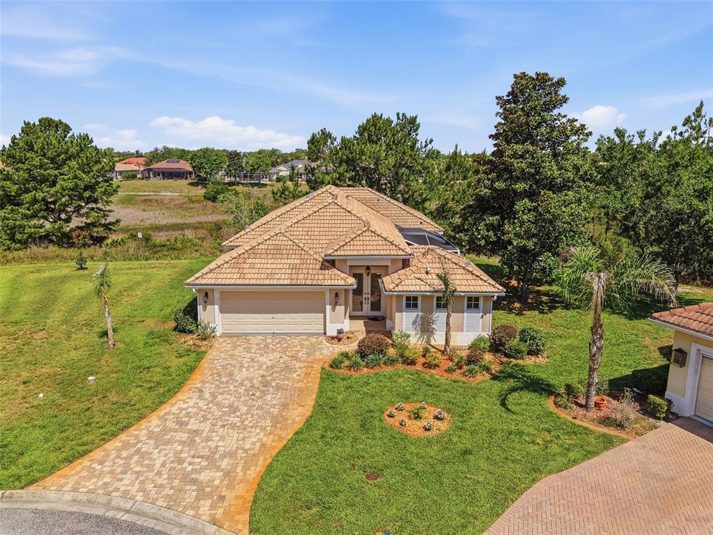 8910 Jericho Road Weeki Wachee, FL 34613 - Photo 4 of 52 an aerial view of a house with a yard