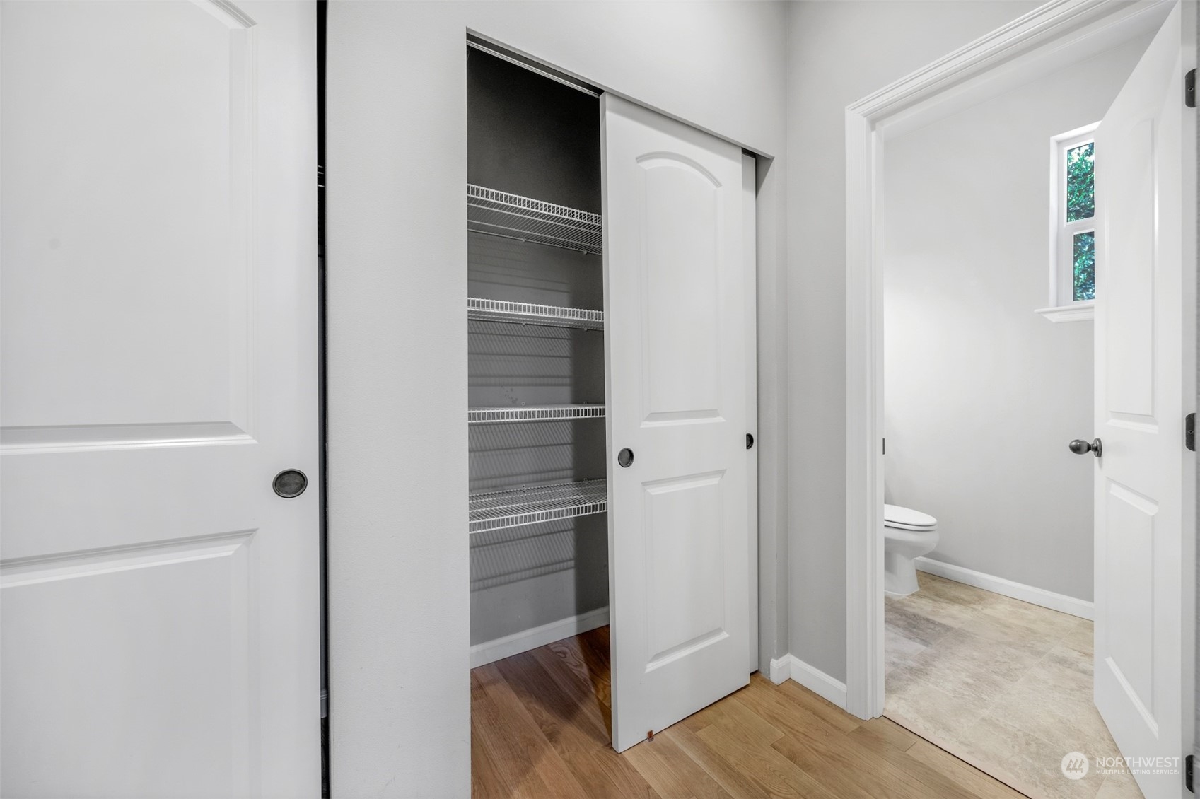 7 213th Street Southeast, Unit B Bothell, WA 98021 - Photo 13 of 34 a view of walk in closet with wooden floor