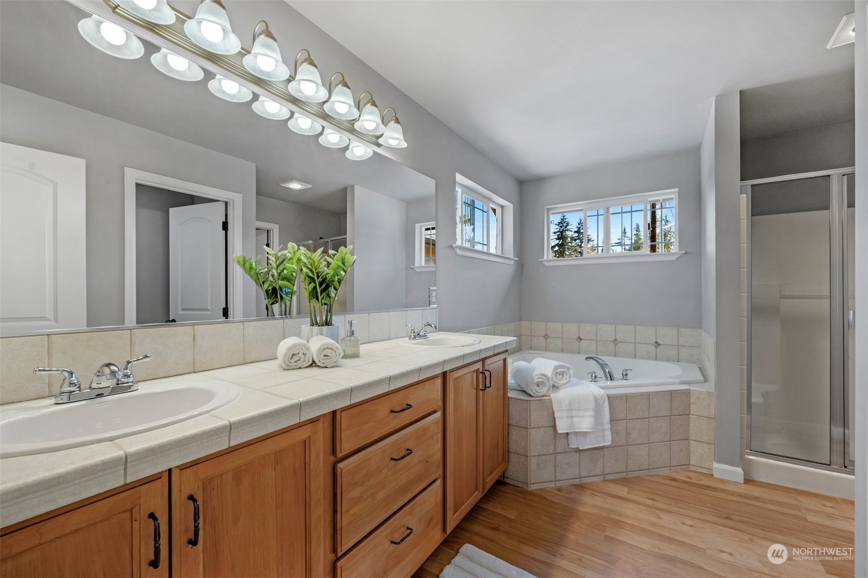 7 213th Street Southeast, Unit B Bothell, WA 98021 - Photo 18 of 34 a bathroom with a double vanity sink and a mirror