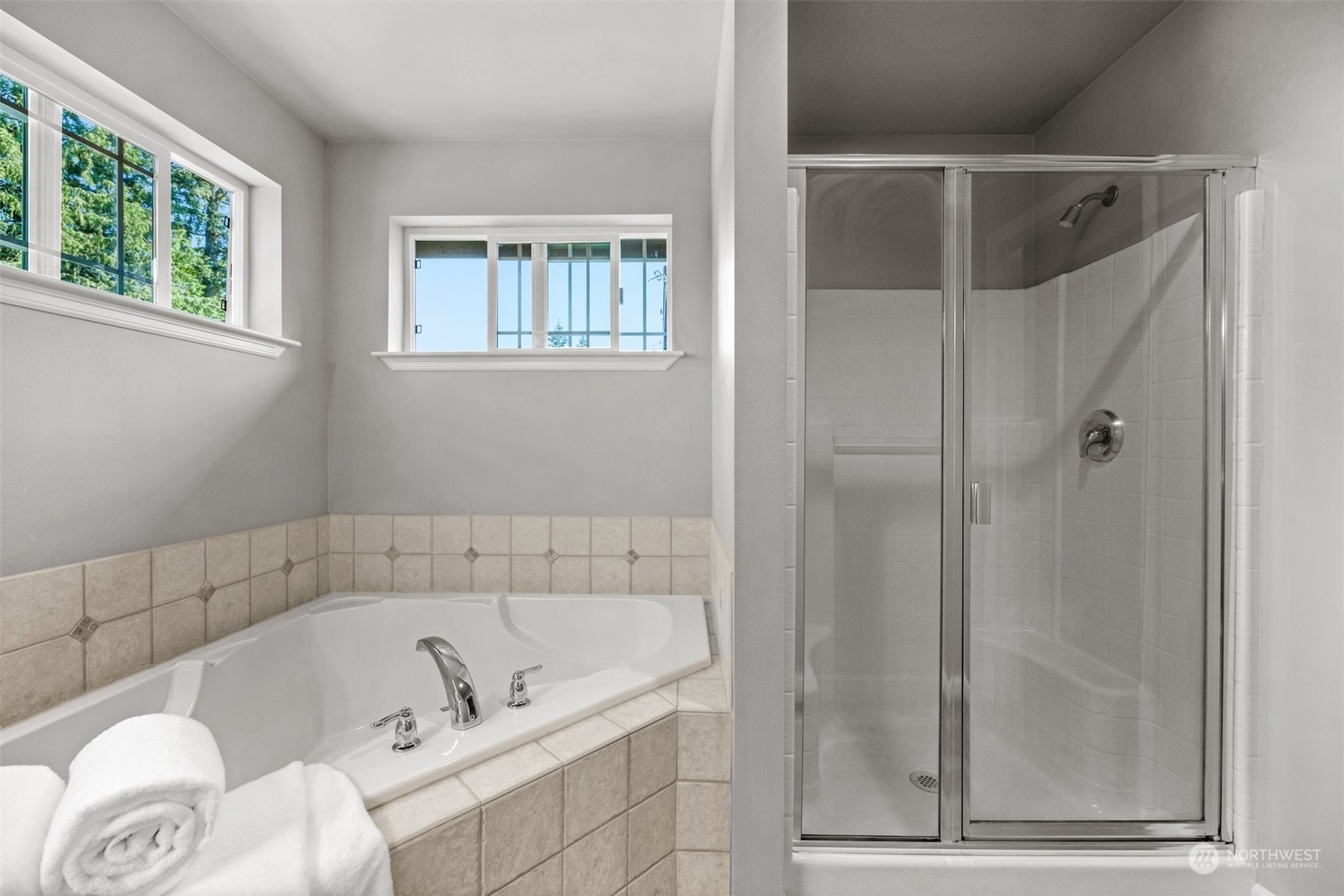 7 213th Street Southeast, Unit B Bothell, WA 98021 - Photo 19 of 34 a bathroom with a tub shower and sink