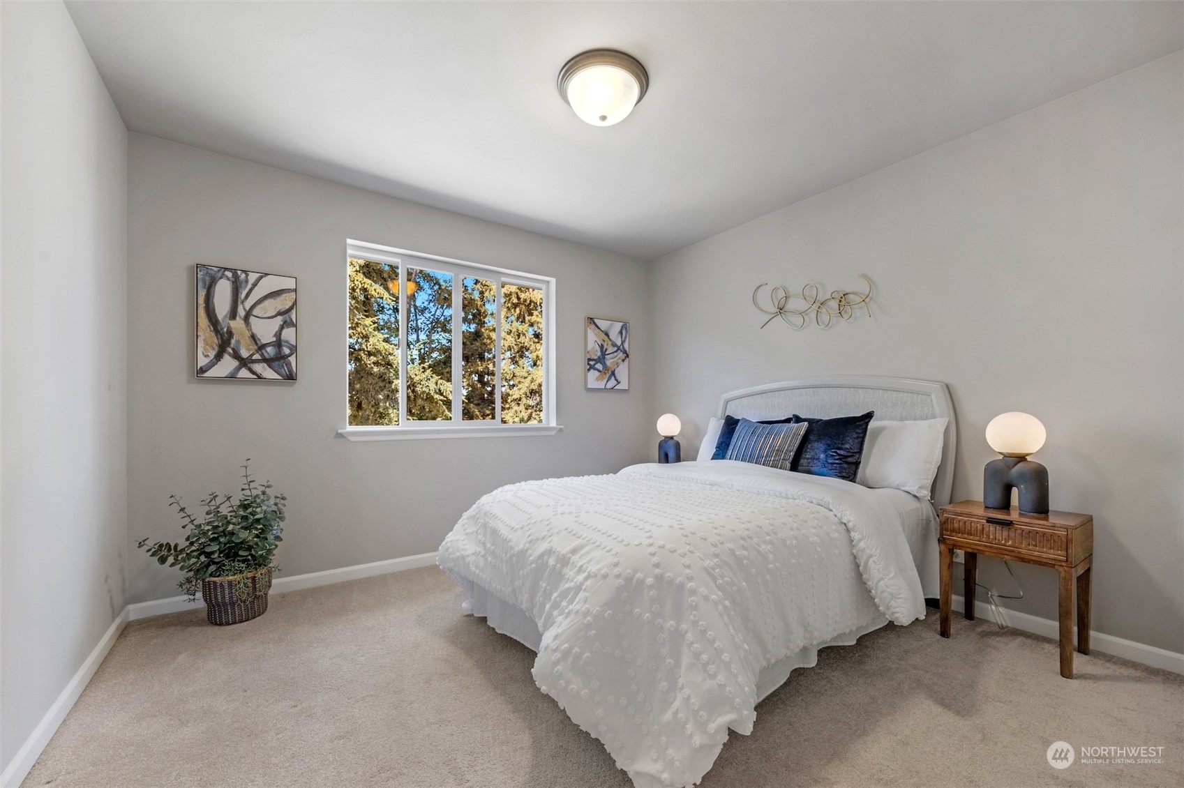 7 213th Street Southeast, Unit B Bothell, WA 98021 - Photo 21 of 34 a bedroom with a bed and a painting on the wall