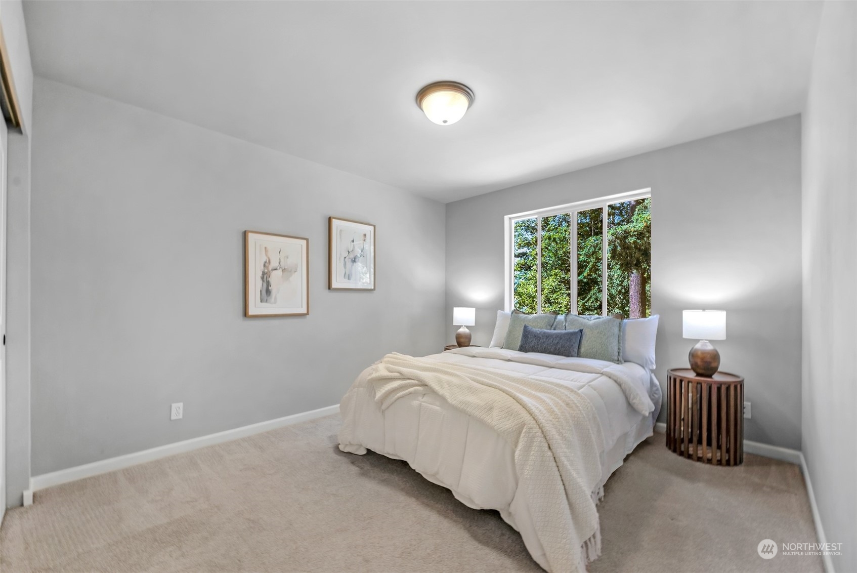 7 213th Street Southeast, Unit B Bothell, WA 98021 - Photo 22 of 34 a bedroom with a bed and a lamp