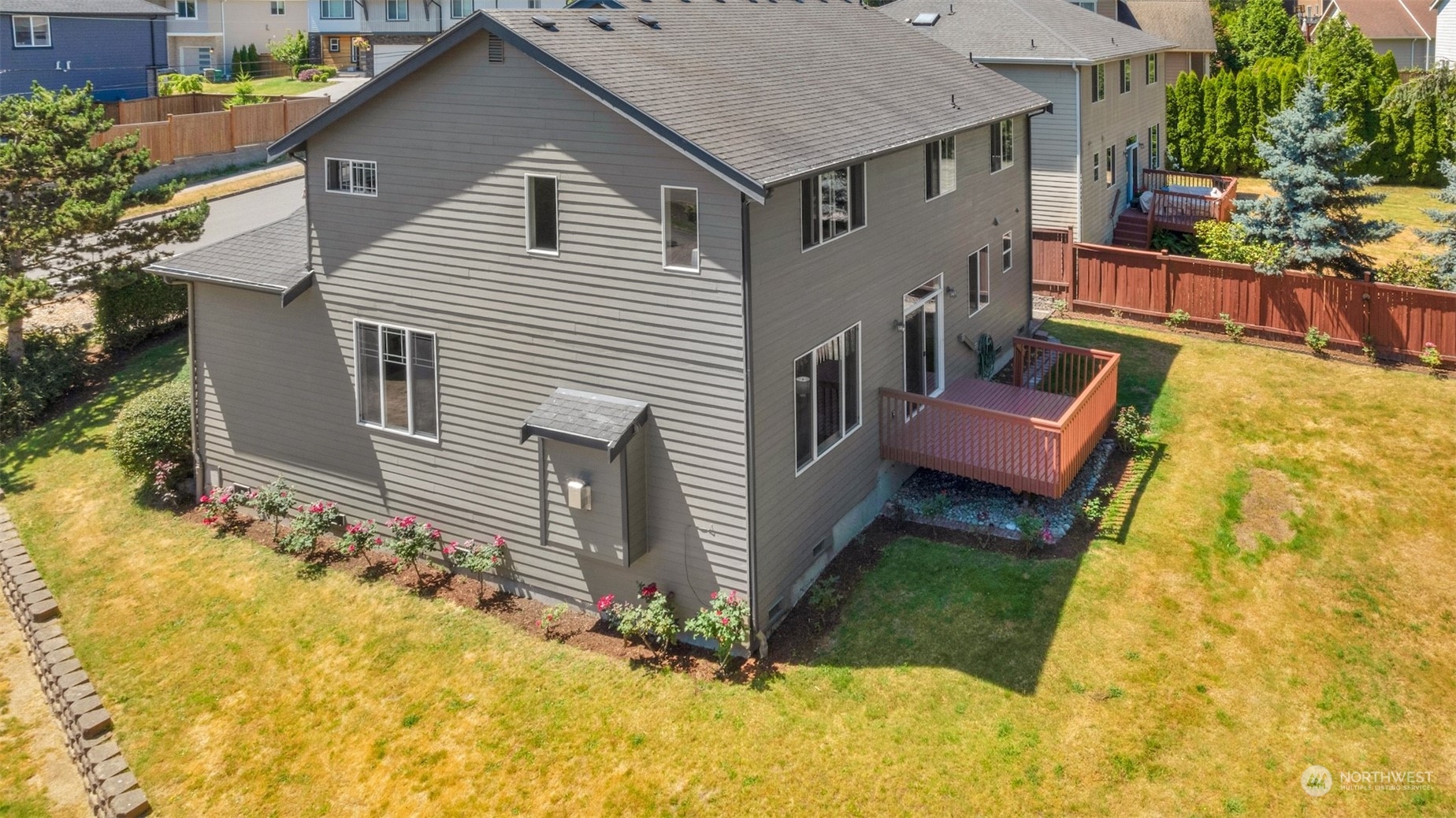 7 213th Street Southeast, Unit B Bothell, WA 98021 - Photo 31 of 34 a yellow house with trees in front of it
