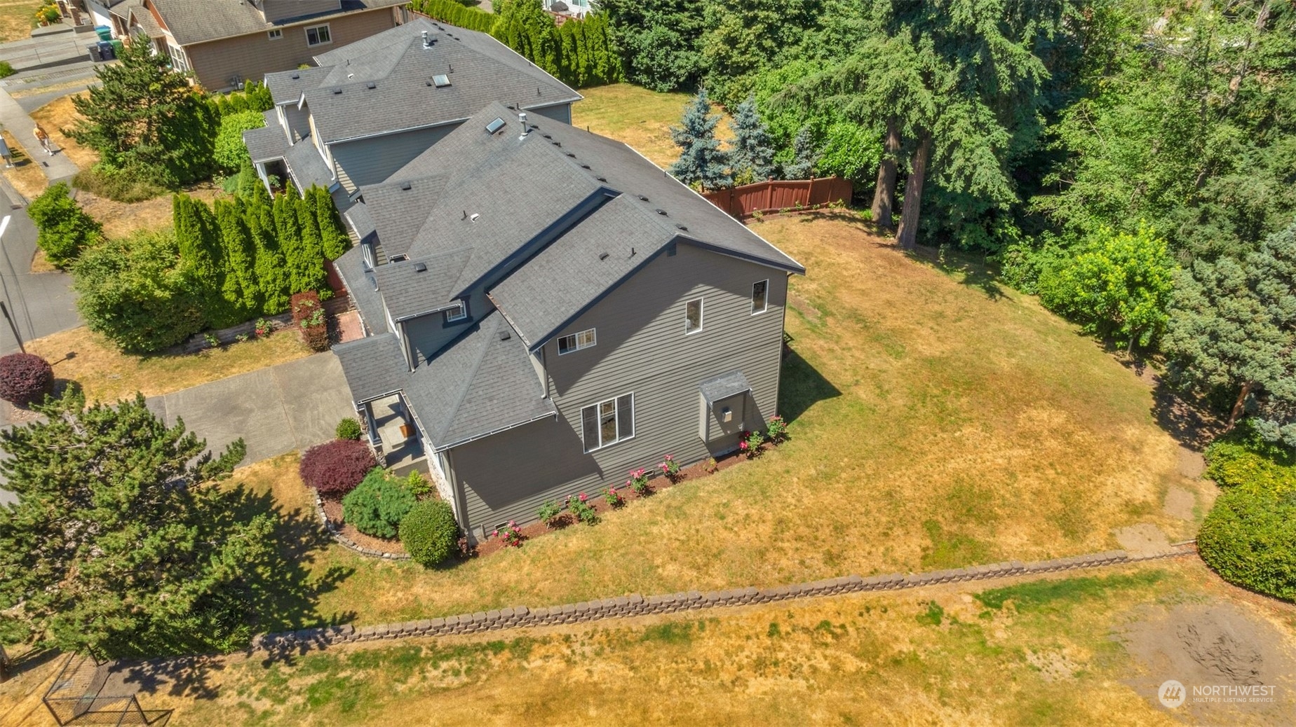 7 213th Street Southeast, Unit B Bothell, WA 98021 - Photo 32 of 34 an aerial view of a house with a yard and trees