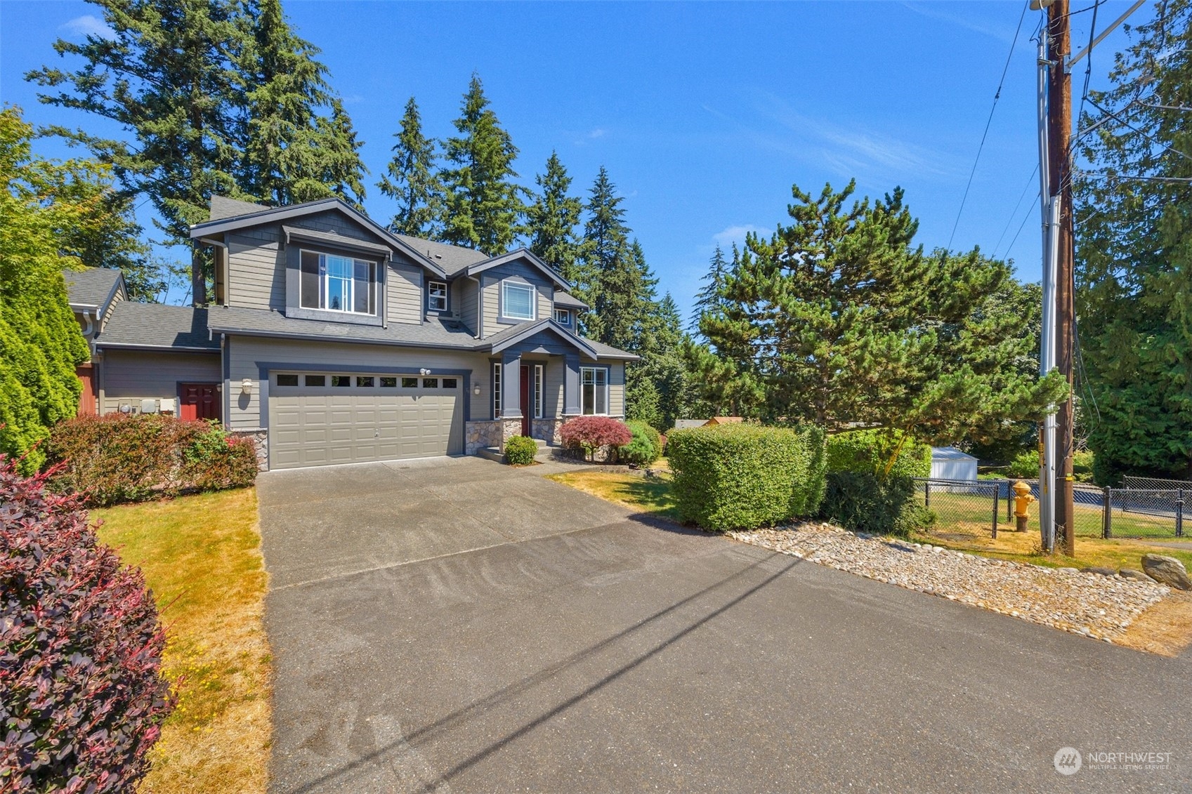 7 213th Street Southeast, Unit B Bothell, WA 98021 - Photo 34 of 34 a front view of a house with a yard and garage