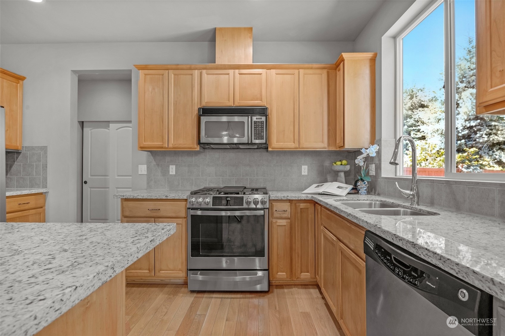 7 213th Street Southeast, Unit B Bothell, WA 98021 - Photo 10 of 34 a kitchen with stainless steel appliances granite countertop a sink stove and microwave