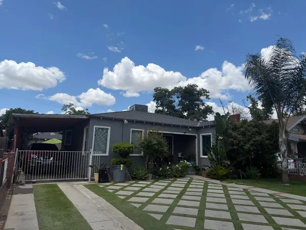 a view of a house with a small yard