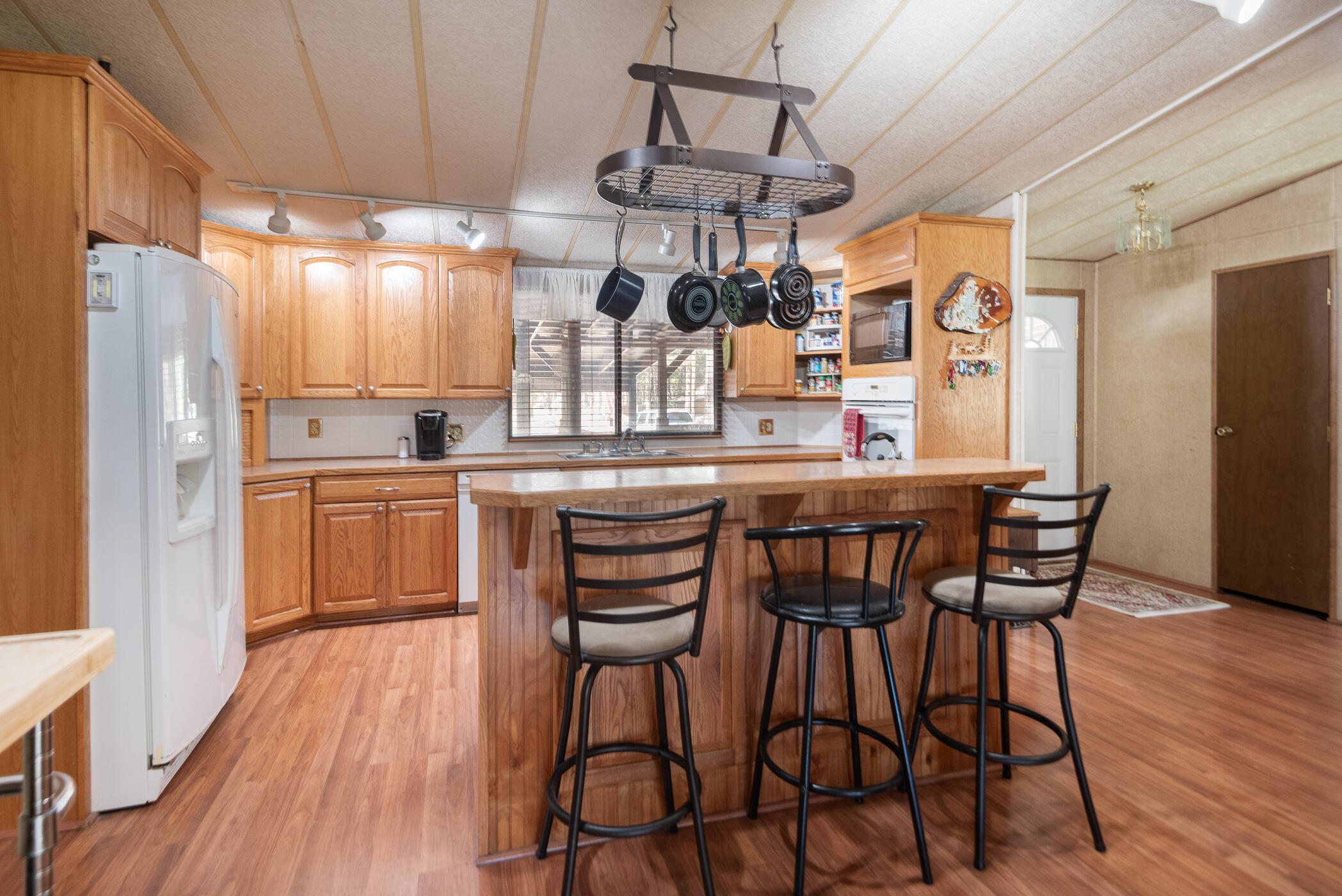 19245 Apache Road Bend, OR 97702 - Photo 6 of 33 The kitchen was remodeled with a wall removed to open it up to dining room