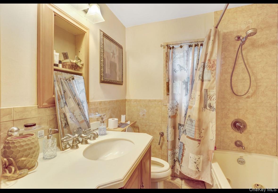 1024 Mahopac Road West Hempstead, NY 11552 - Photo 15 of 25 a bathroom with a granite countertop sink and a mirror