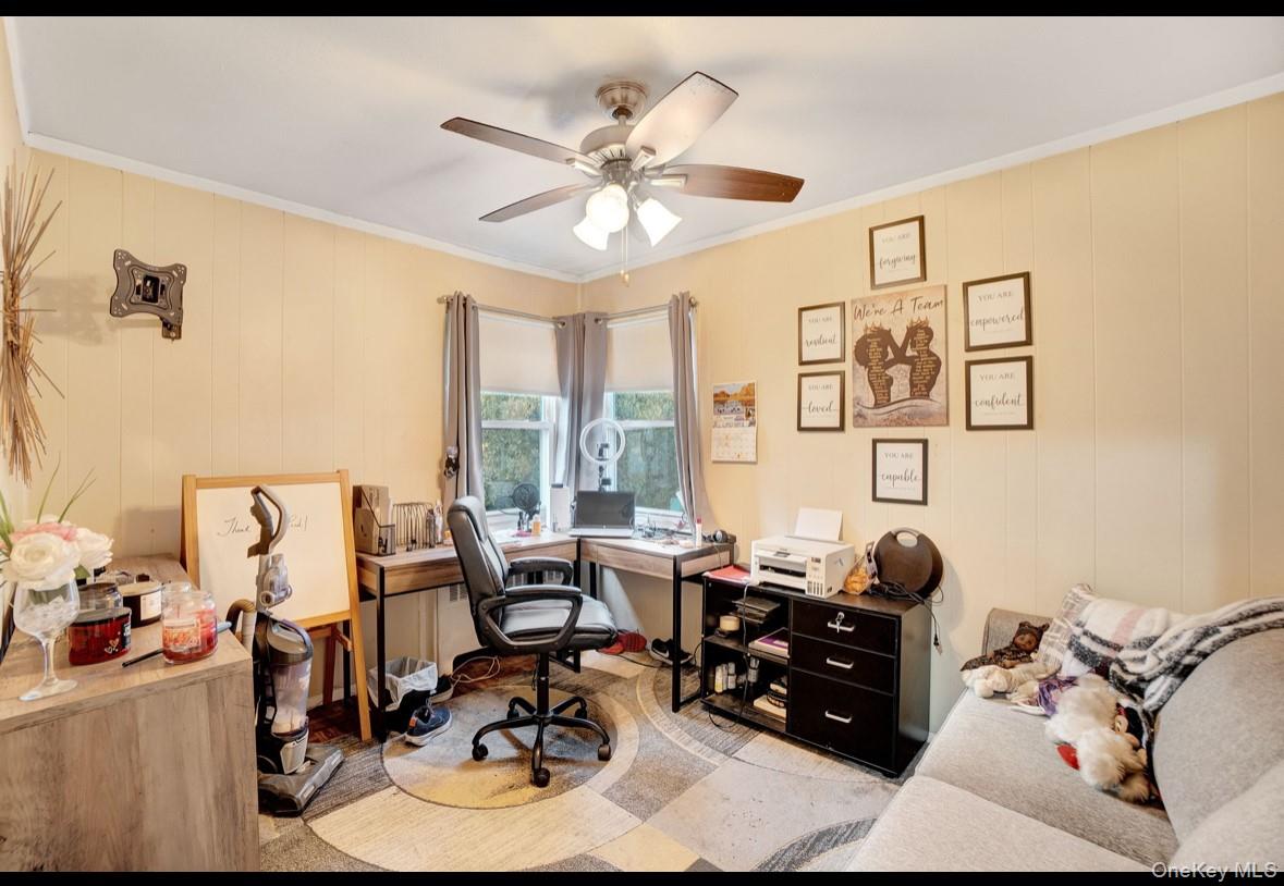 1024 Mahopac Road West Hempstead, NY 11552 - Photo 17 of 25 a living room with furniture and large windows