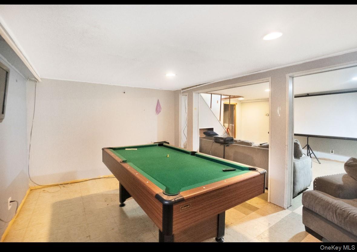 1024 Mahopac Road West Hempstead, NY 11552 - Photo 23 of 25 a room with pool table and sofas