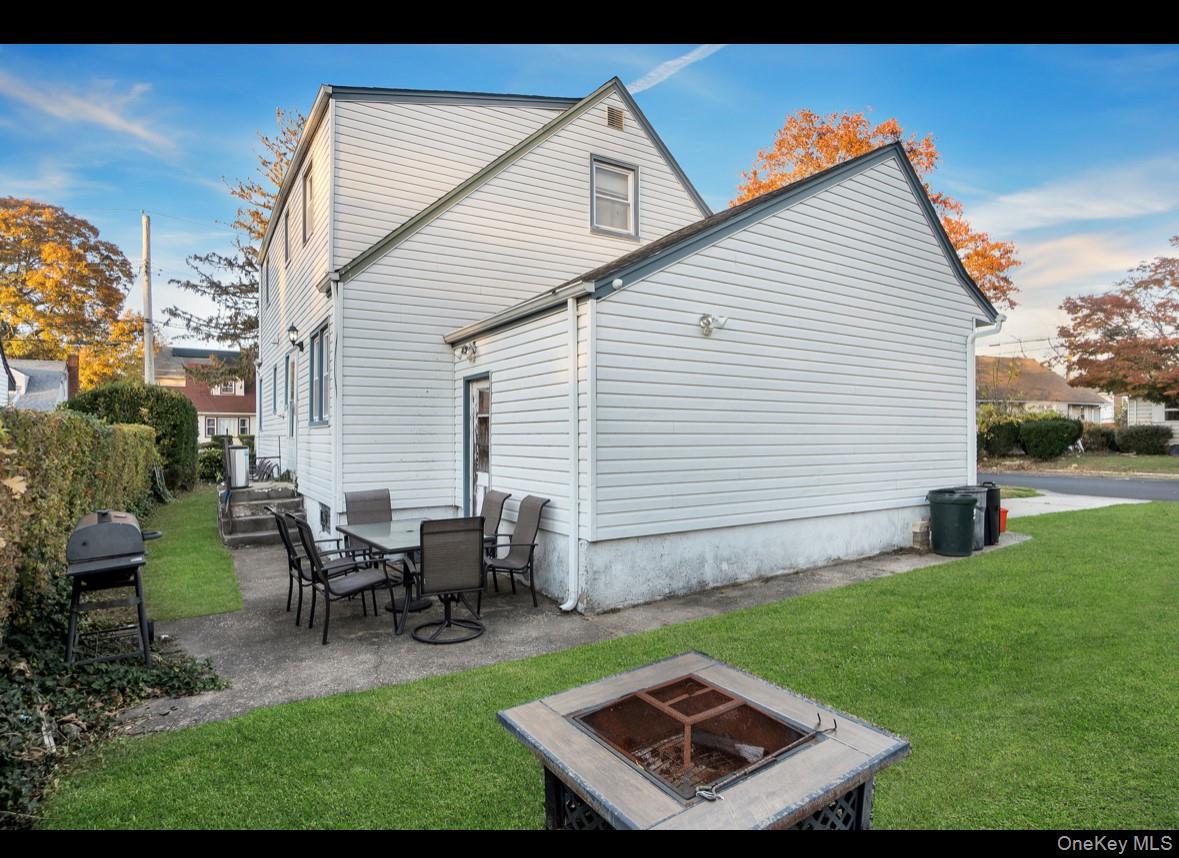 1024 Mahopac Road West Hempstead, NY 11552 - Photo 5 of 25 a backyard of a house with table and chairs