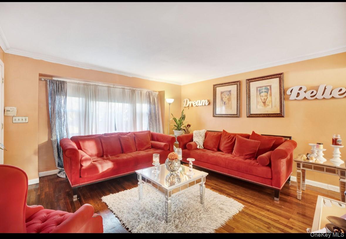 1024 Mahopac Road West Hempstead, NY 11552 - Photo 8 of 25 a living room with furniture and a couch