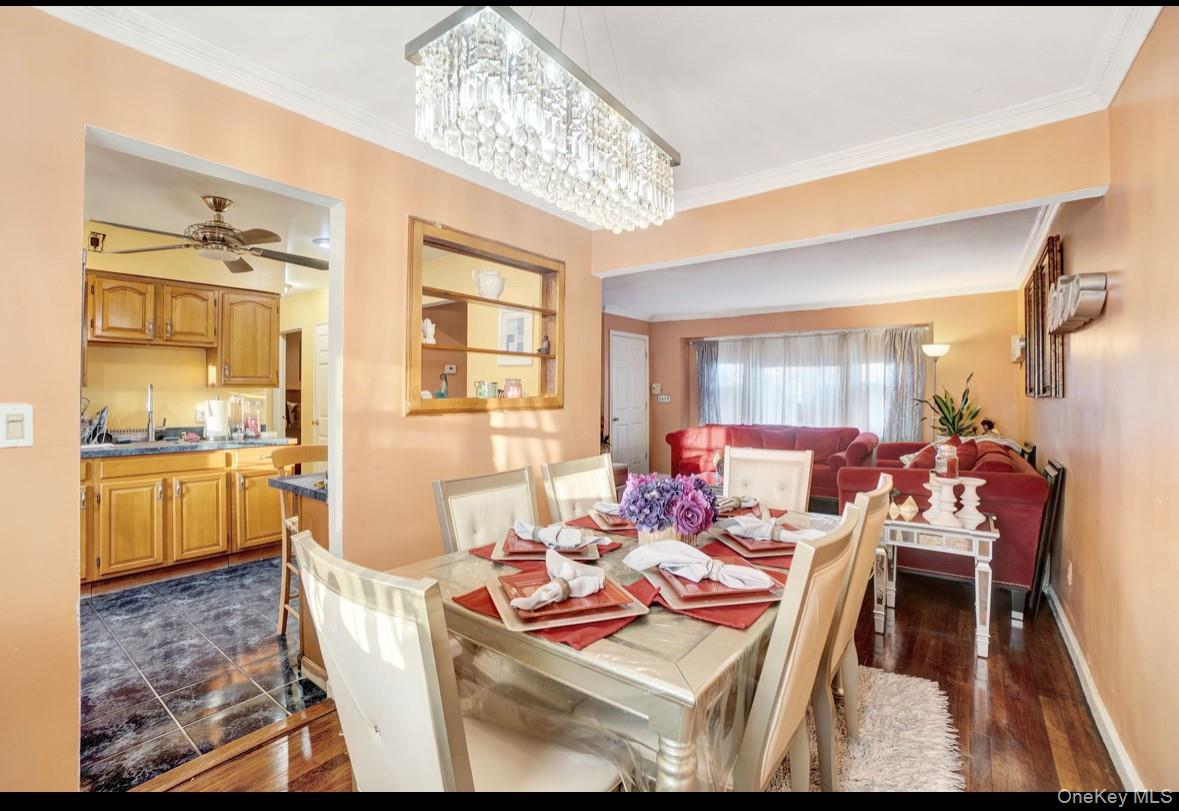 1024 Mahopac Road West Hempstead, NY 11552 - Photo 10 of 25 a living room with furniture and a chandelier