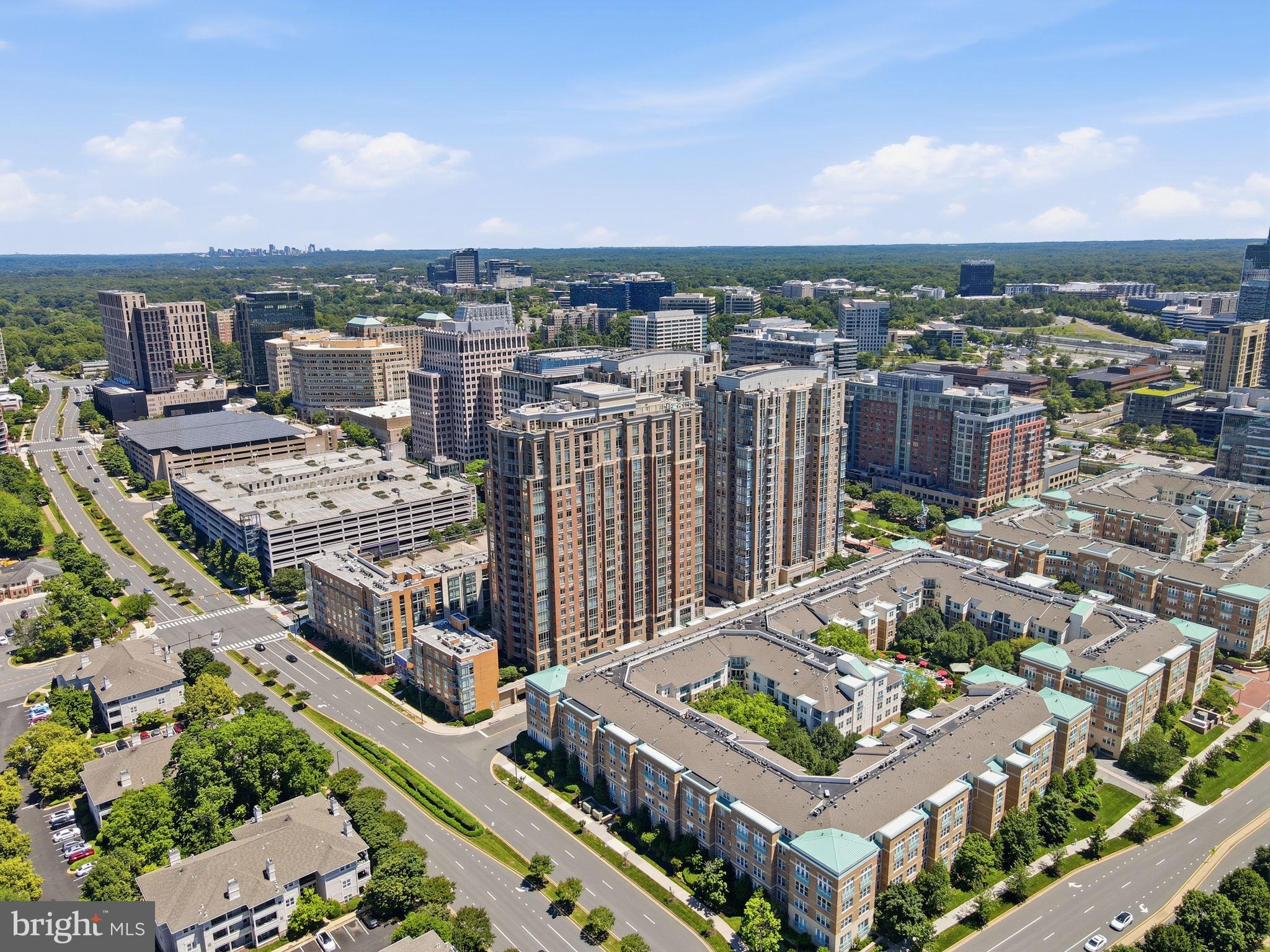 11990 Market Street, Unit 2103 Reston, VA 20190 - Photo 73 of 78 Urban skyline with modern architecture.