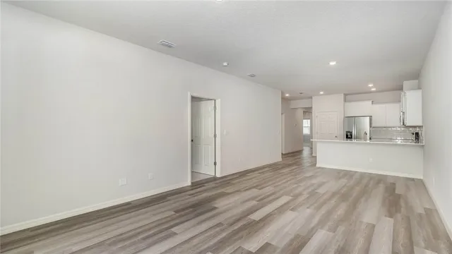a view of a kitchen with wooden floor