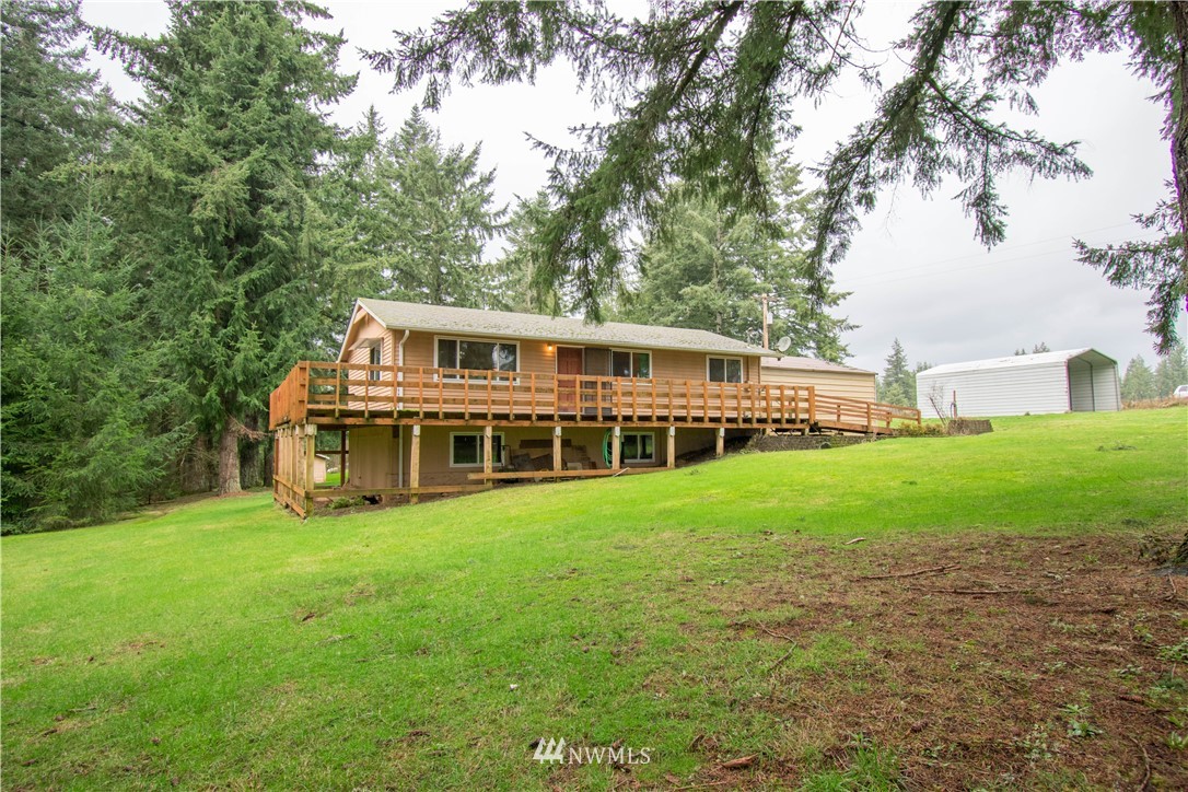 265 A Dieckman Road Chehalis, WA 98532 - Photo 1 of 20 a front view of a house with a garden and trees