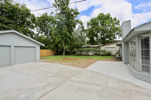 a view of backyard of house garage