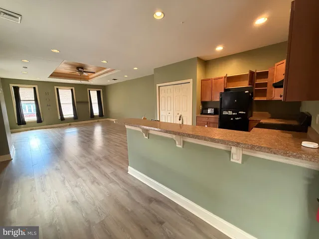 a view of a room with wooden floor