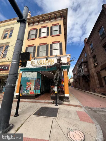 a view of a building with sitting area