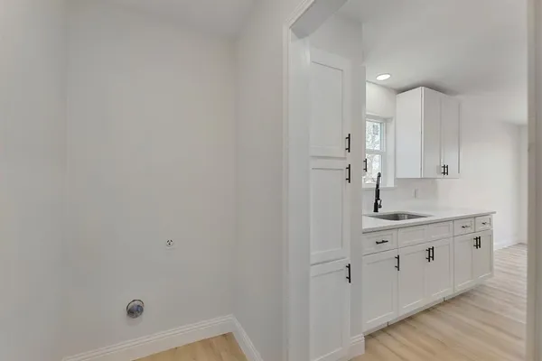a bathroom with a sink a mirror and shower