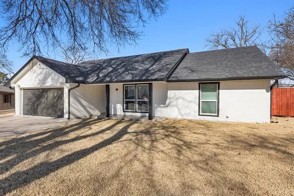 a house with yard in front of it