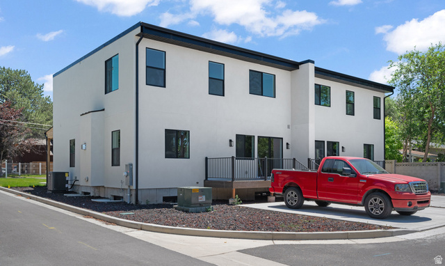 7238 South 525 East Midvale, UT 84047 - Photo 28 of 29 Contemporary multi-level exterior with white stucco finish and black trim