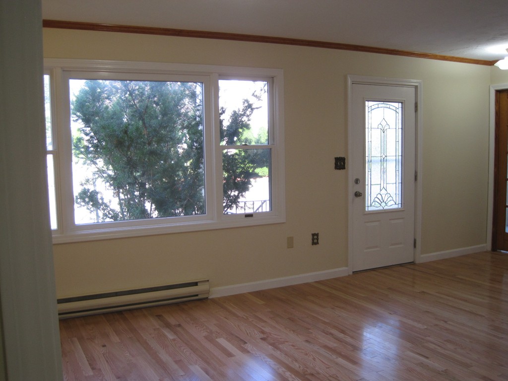 11 Kovey Road Boston, MA 02136 - Photo 4 of 30 an empty room with wooden floor and windows