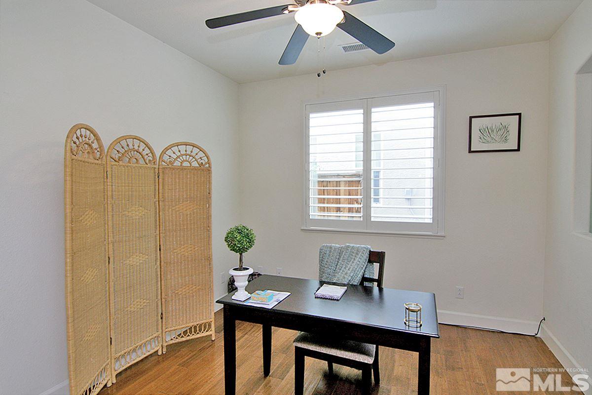 11215 Parma Way Reno, NV 89521 - Photo 4 of 22 a view of a workspace with furniture and a window