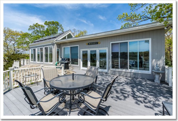 67 Border Street Scituate, MA 02066 - Photo 11 of 30 a view of a house with backyard sitting area and garden