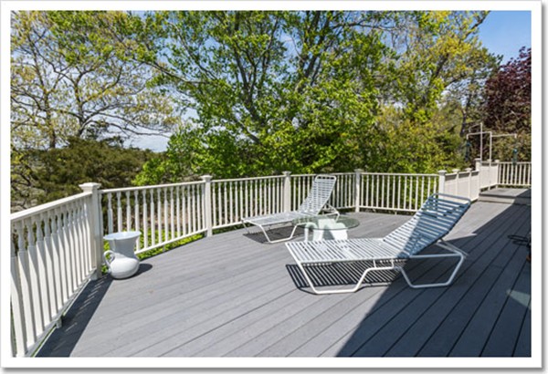 67 Border Street Scituate, MA 02066 - Photo 14 of 30 a view of balcony with wooden floor outdoor seating and yard in the back