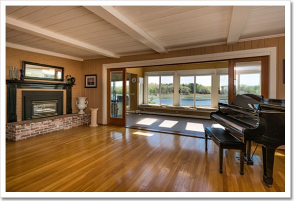 67 Border Street Scituate, MA 02066 - Photo 20 of 30 a living room with furniture and a fireplace