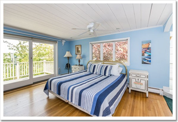 67 Border Street Scituate, MA 02066 - Photo 26 of 30 a bed sitting in a bedroom next to a window