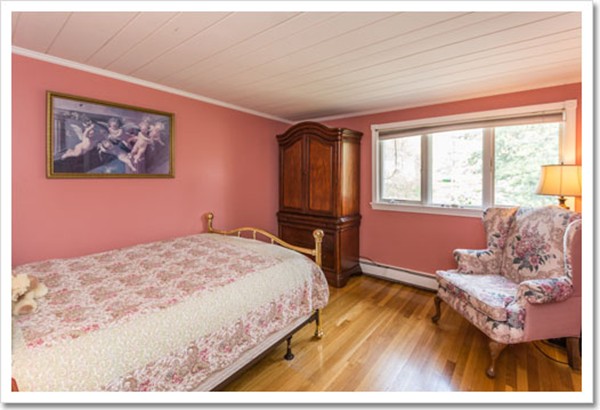 67 Border Street Scituate, MA 02066 - Photo 29 of 30 a bedroom with a bed and wooden floor