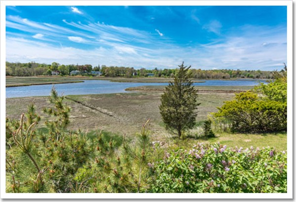 67 Border Street Scituate, MA 02066 - Photo 3 of 30 a view of a lake with houses in the background