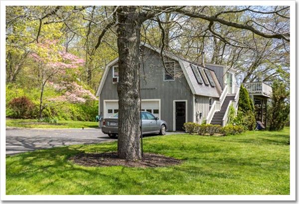 67 Border Street Scituate, MA 02066 - Photo 6 of 30 a view of a yard in front of a house with a large tree