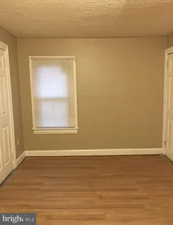 a bathroom with a sink vanity mirror and toilet