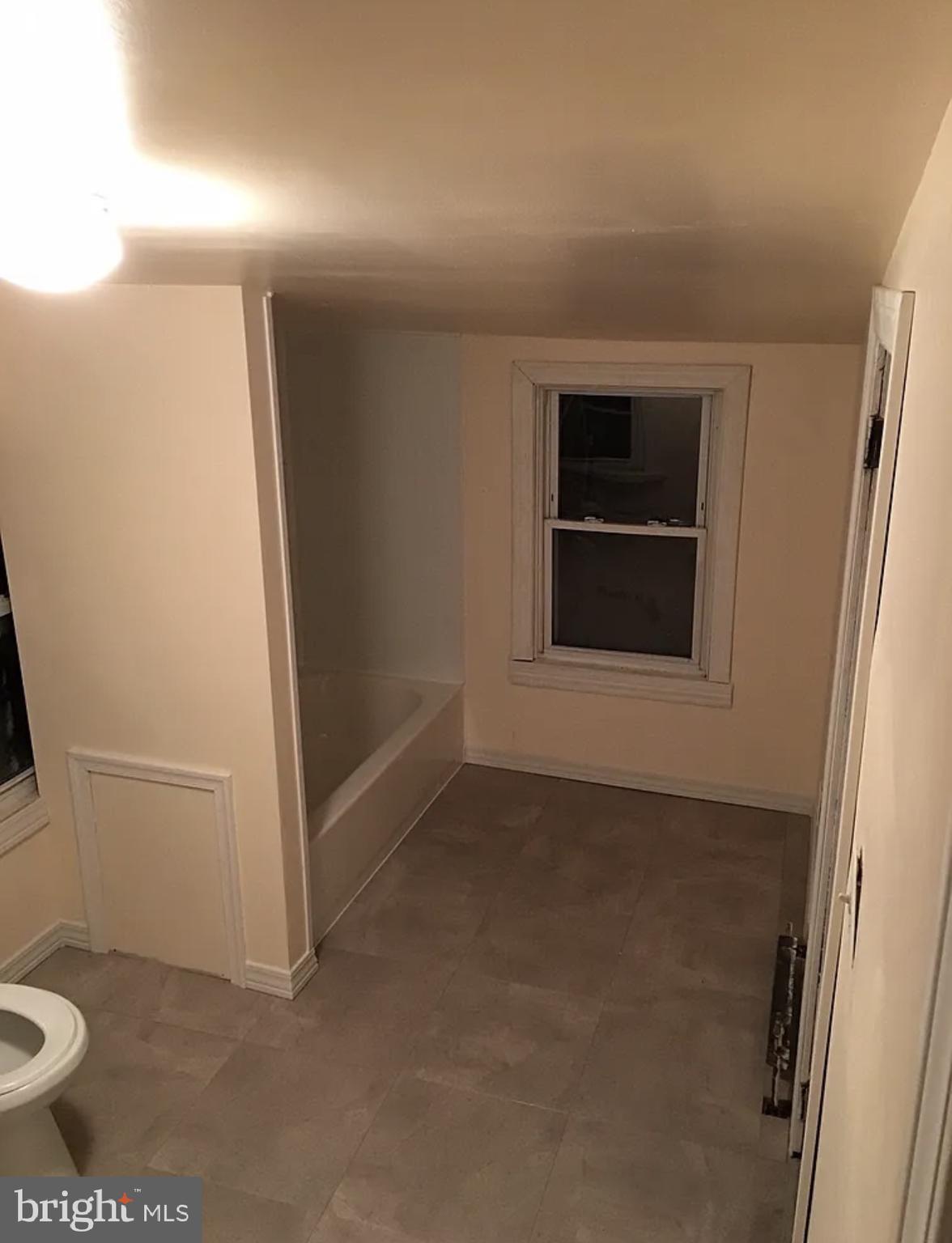 37 Olive Street Salem, NJ 08079 - Photo 17 of 19 an empty room with a bathroom