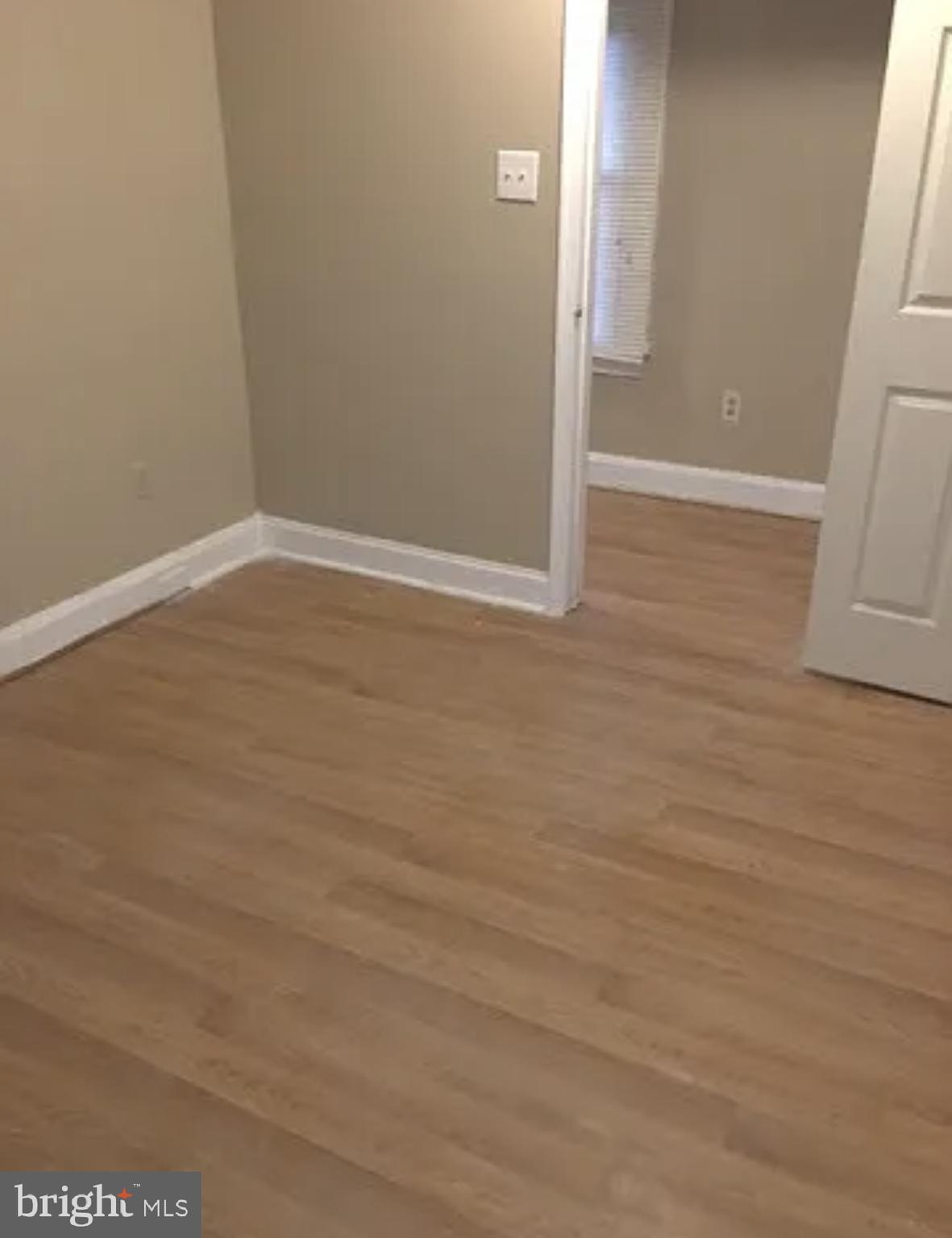 37 Olive Street Salem, NJ 08079 - Photo 9 of 19 a view of an empty room with wooden floor