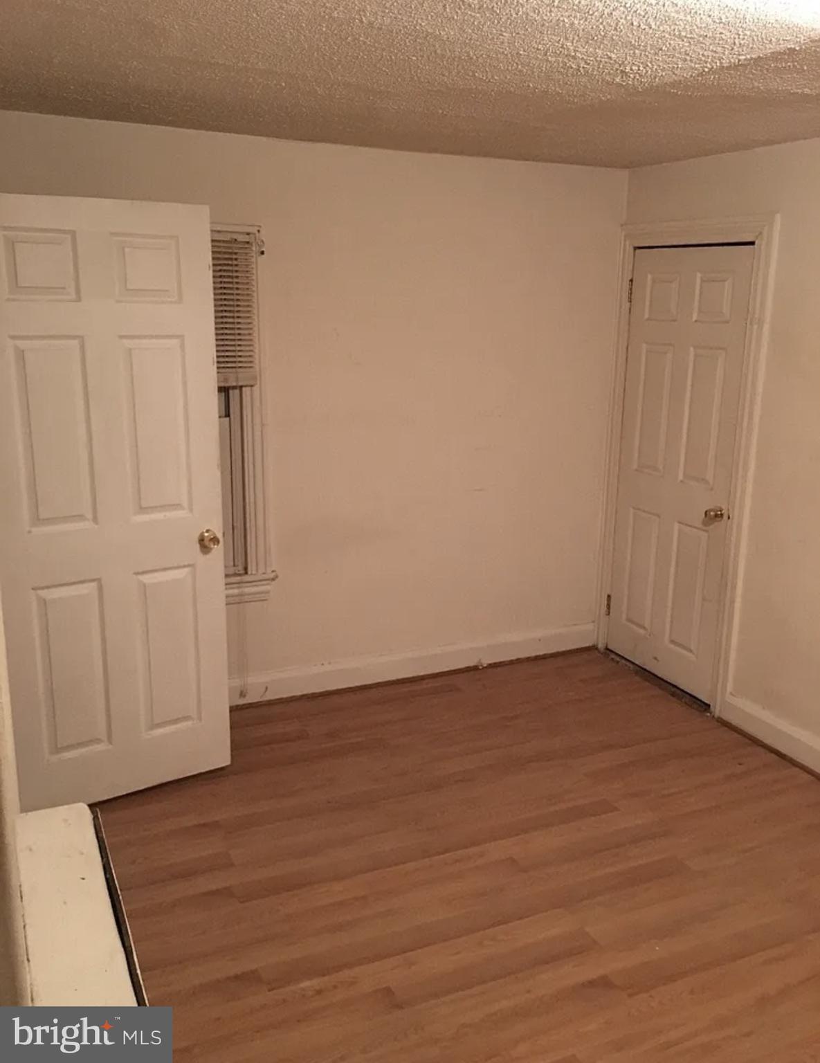 37 Olive Street Salem, NJ 08079 - Photo 10 of 19 a view of an empty room with wooden floor
