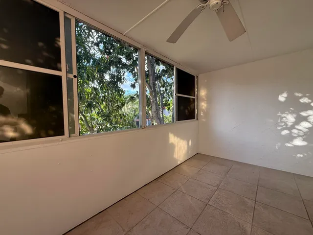 a view of livingroom with furniture and floor to ceiling window