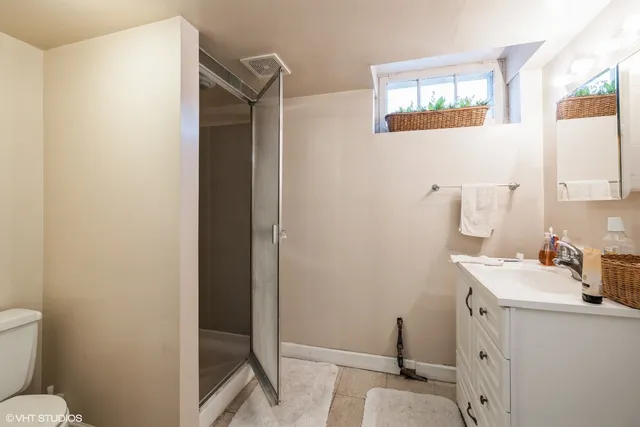 a bathroom with a sink toilet and vanity
