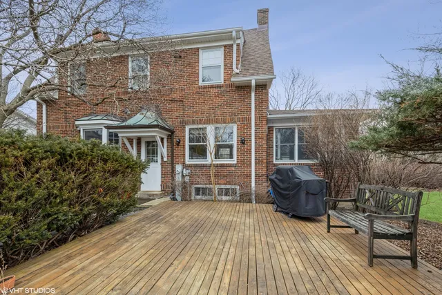 a view of house with patio outdoor seating and wooden floor