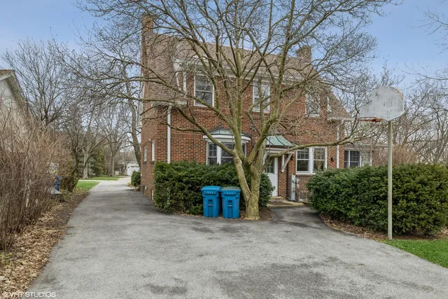 front view of a house with a garden