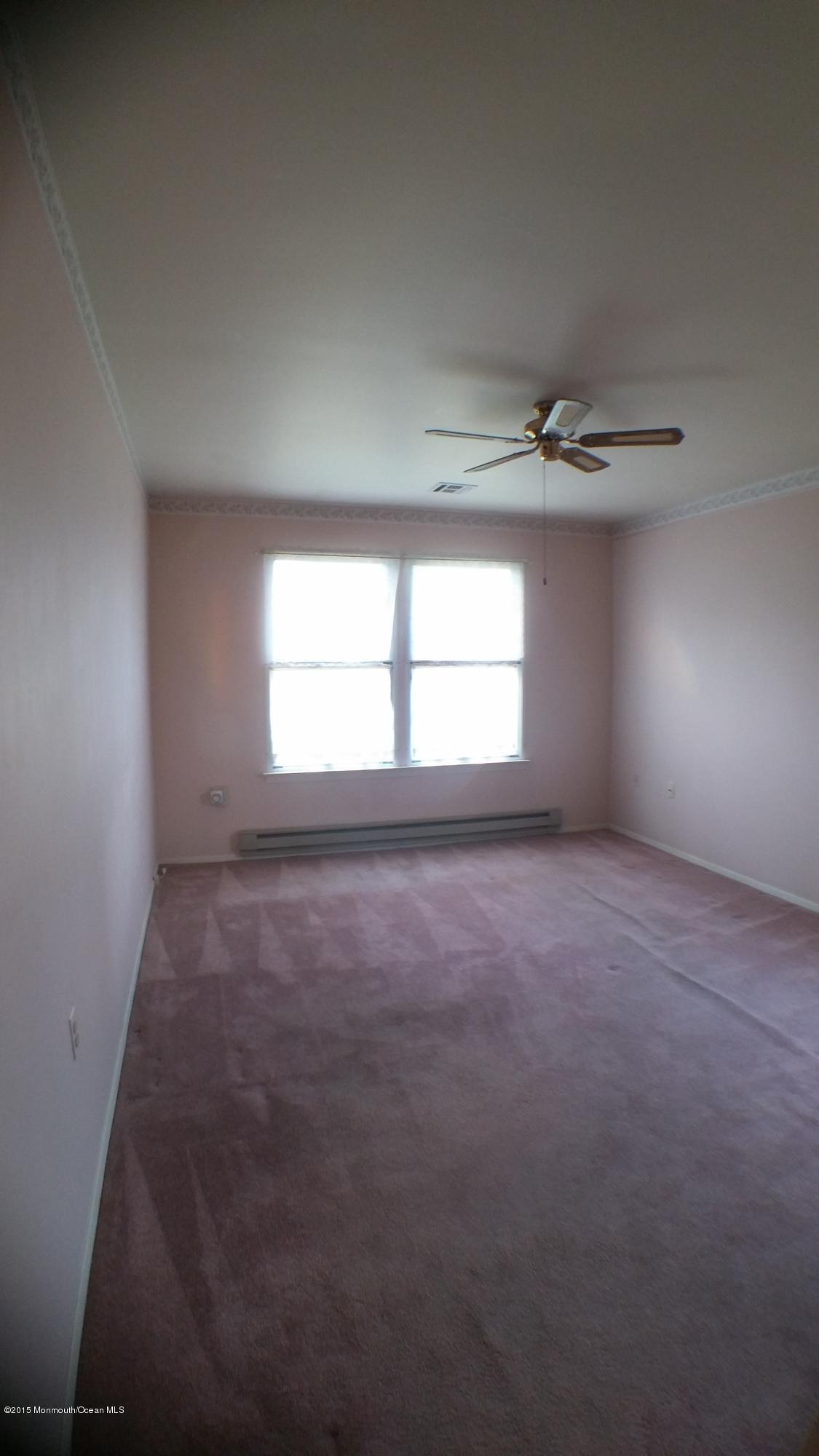 23B Mill Road, Unit B Whiting, NJ 08759 - Photo 14 of 22 an empty room with a empty space and windows