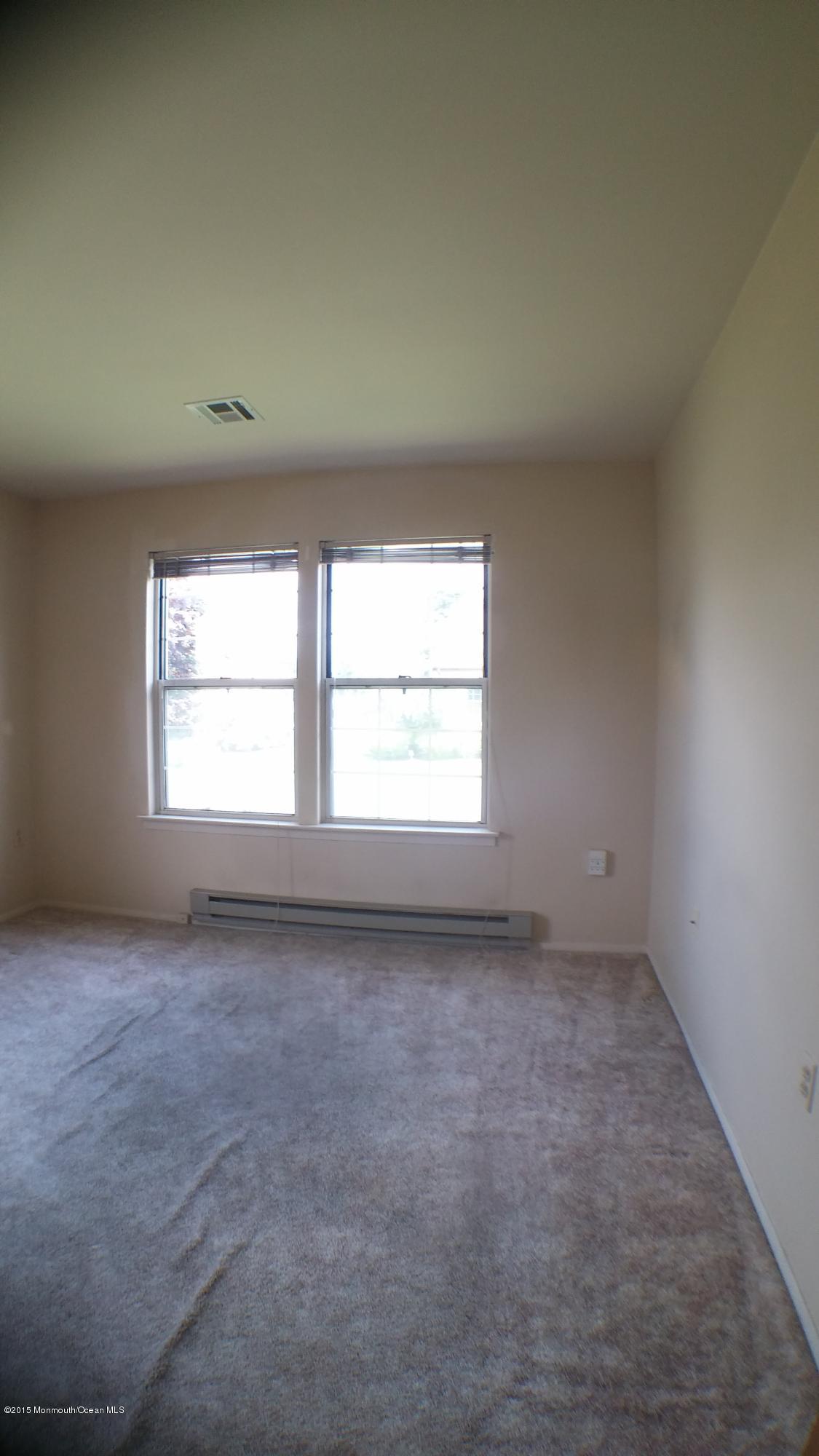 23B Mill Road, Unit B Whiting, NJ 08759 - Photo 16 of 22 an empty room with a window