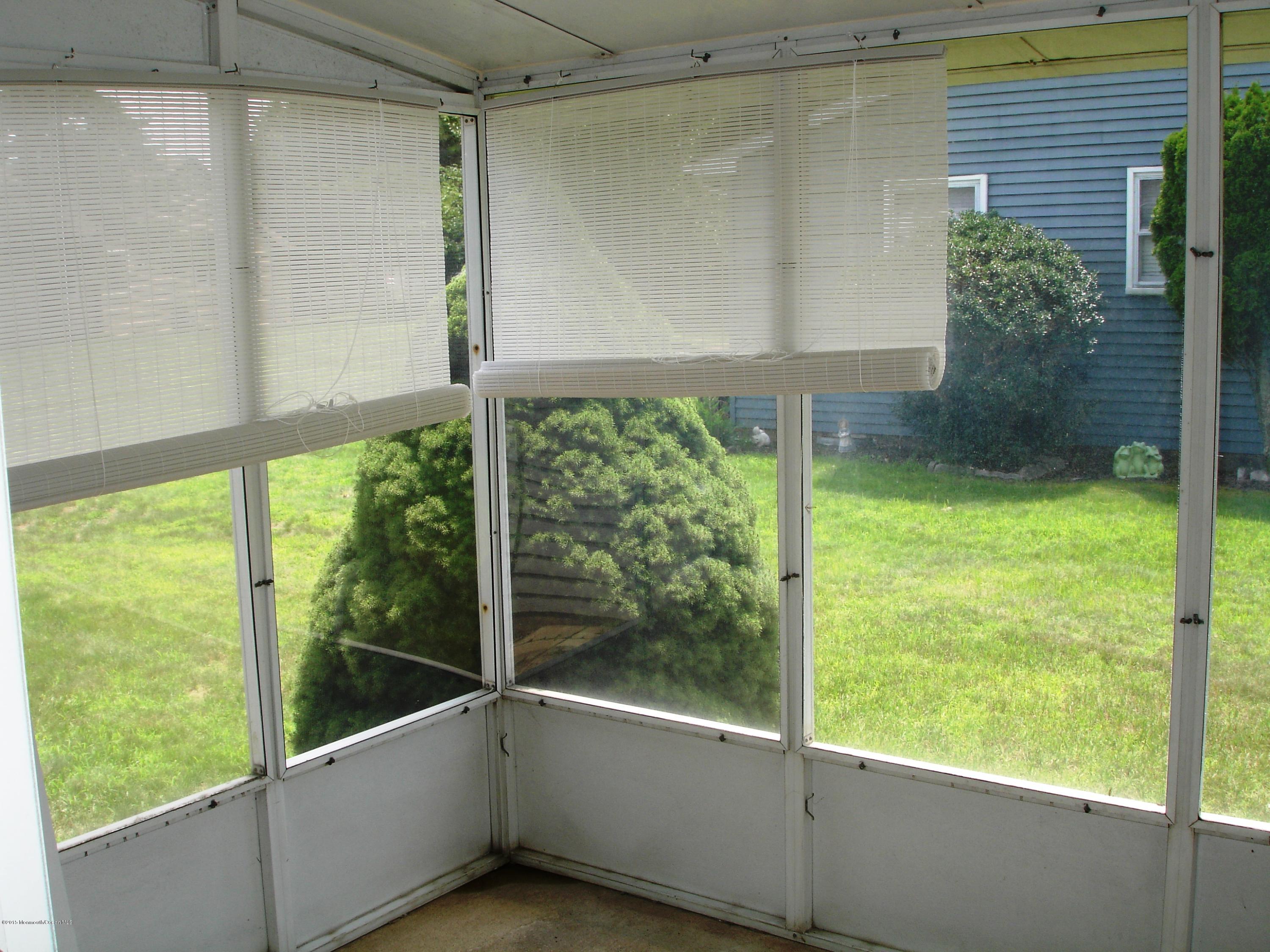 23B Mill Road, Unit B Whiting, NJ 08759 - Photo 4 of 22 a view of a glass door with a tree in it