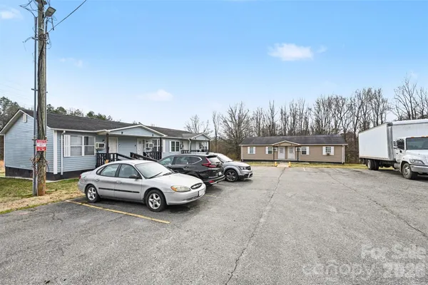 a view of a car parked in front of a house