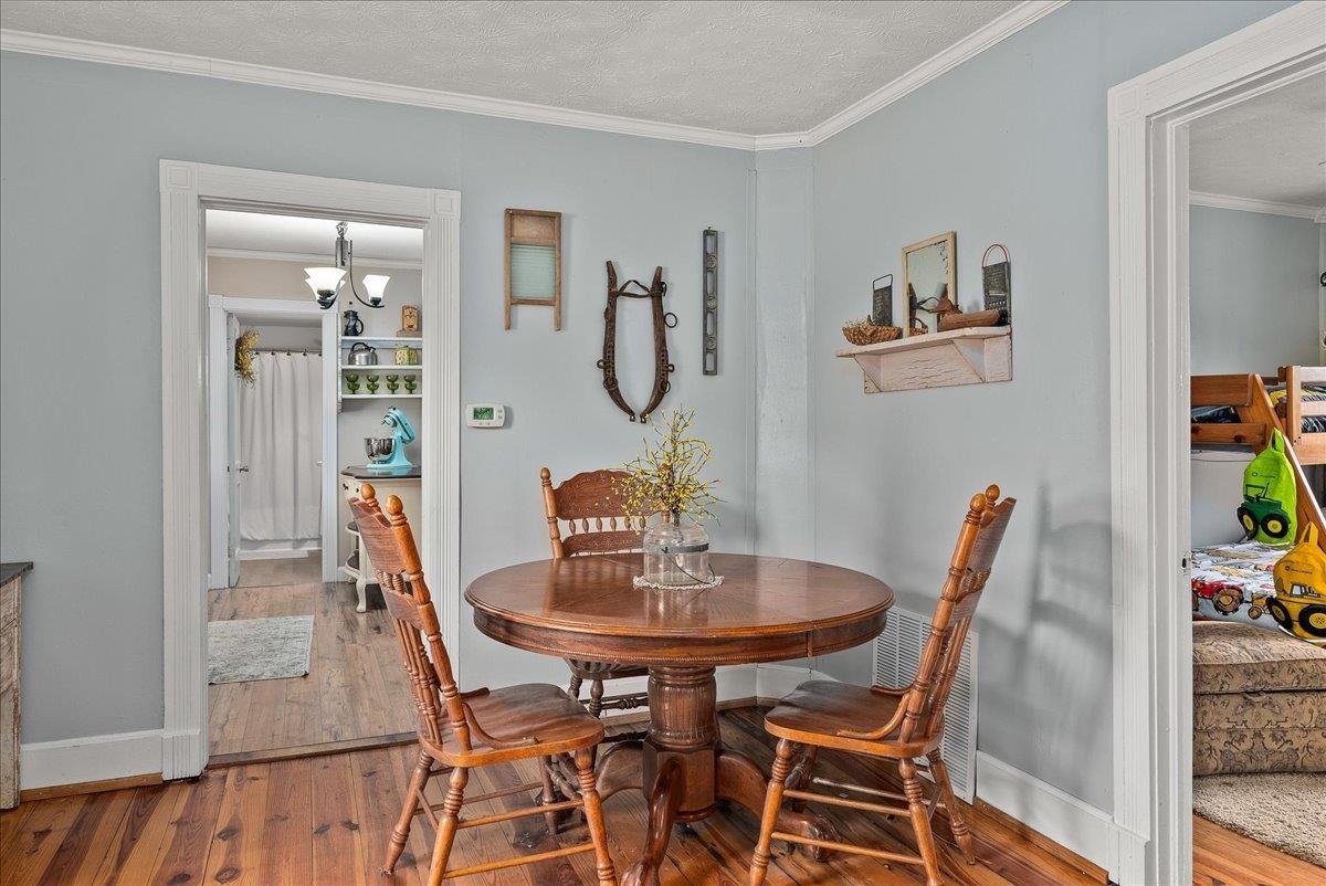 454 Dooms Crossing Road Waynesboro, VA 22980 - Photo 6 of 35 a view of a dining room with furniture and wooden floor